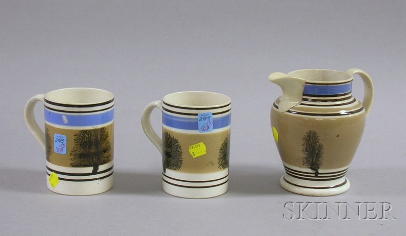 Appraisal: Pair of English Seaweed Decorated Banded Mochaware Mugs and a