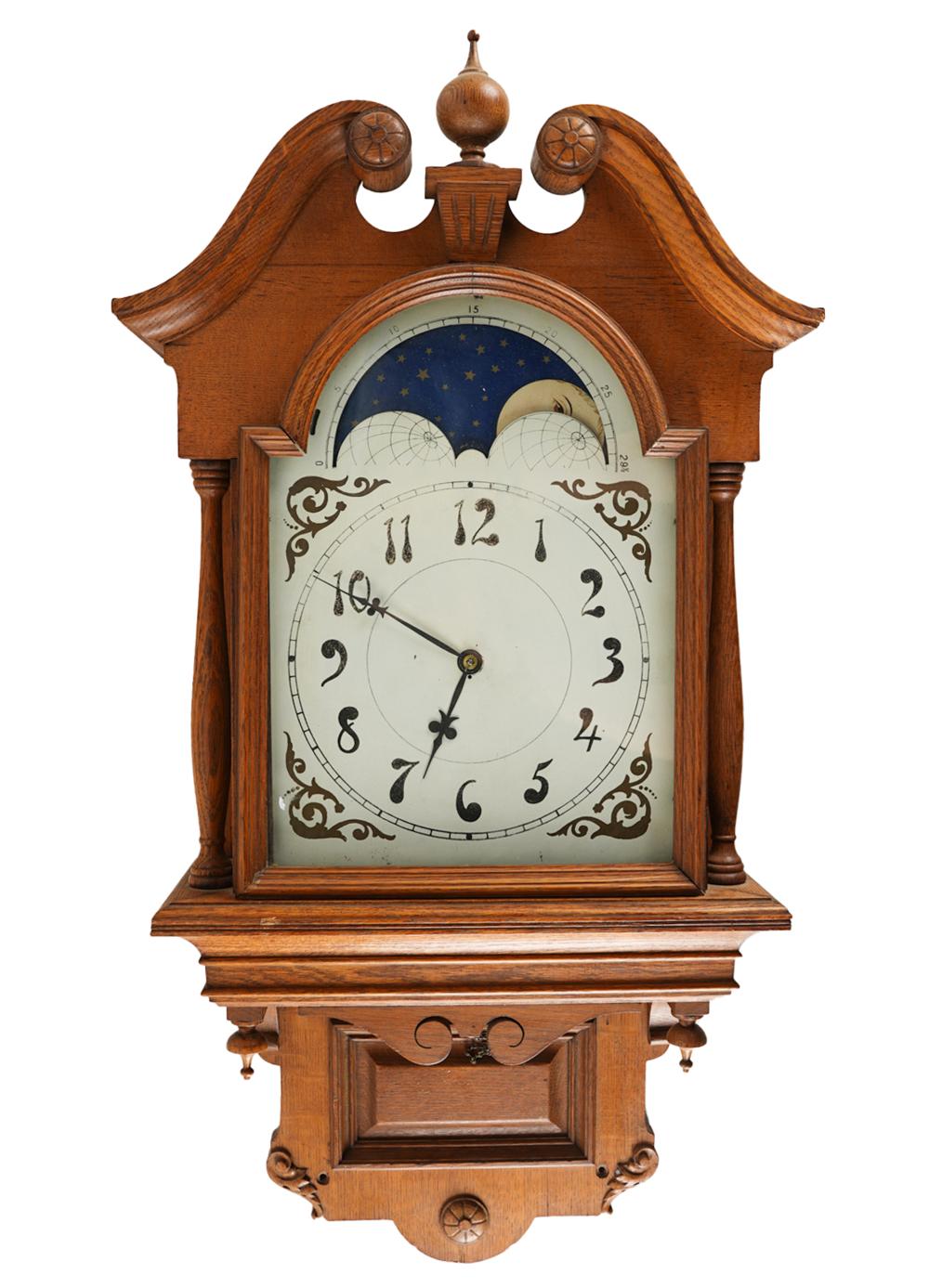 Appraisal: CARVED OAK WALL CLOCKunsigned painted metal dial with moon phase