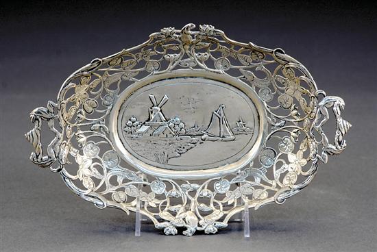 Appraisal: Continental silver reticulated bowl first half th centuryoval chased scenes