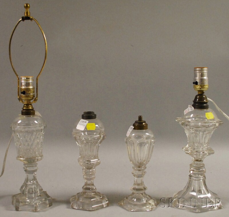 Appraisal: Four Colorless Pressed Glass Fluid Lamps including two Sandwich