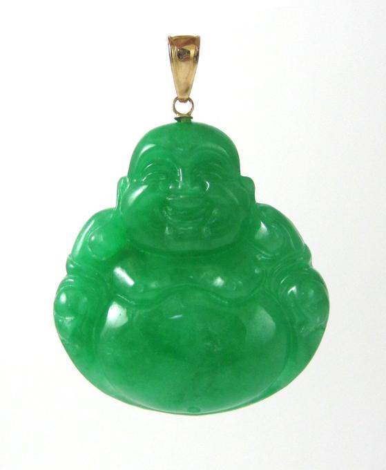 Appraisal: JADE AND FOURTEEN KARAT GOLD PENDANT with a large carved