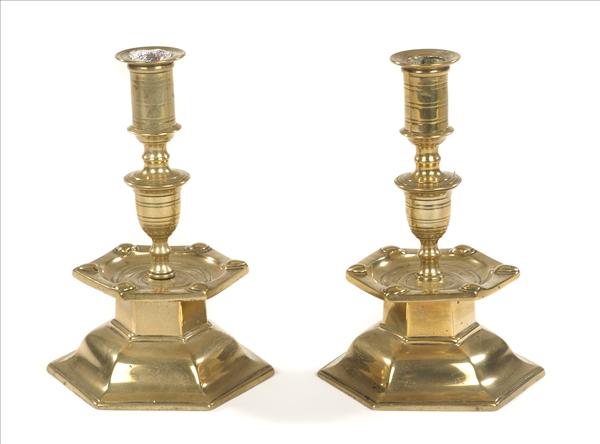 Appraisal: A pair of brass tencher style candlesticks each with a