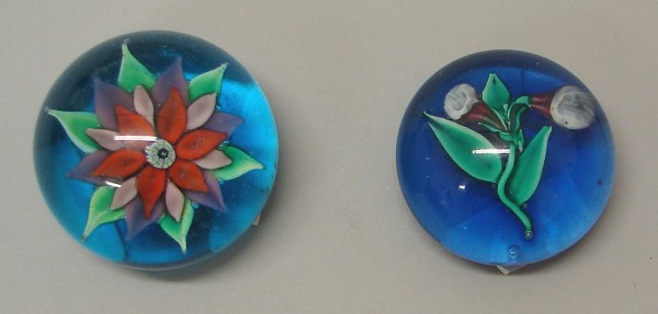 Appraisal: Lot of two Paperweights feature flower design at center and