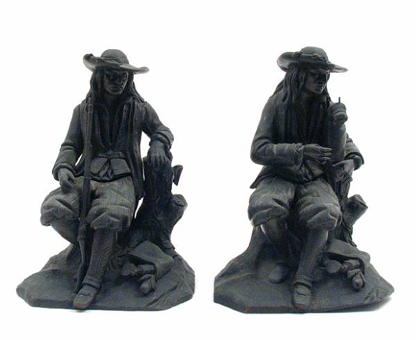 Appraisal: A pair of patinated bronze figures of seated gentlemen height