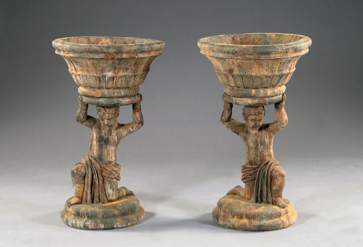 Appraisal: Pair of Cast-Stone Two-Part Garden Urns each depicting a partially