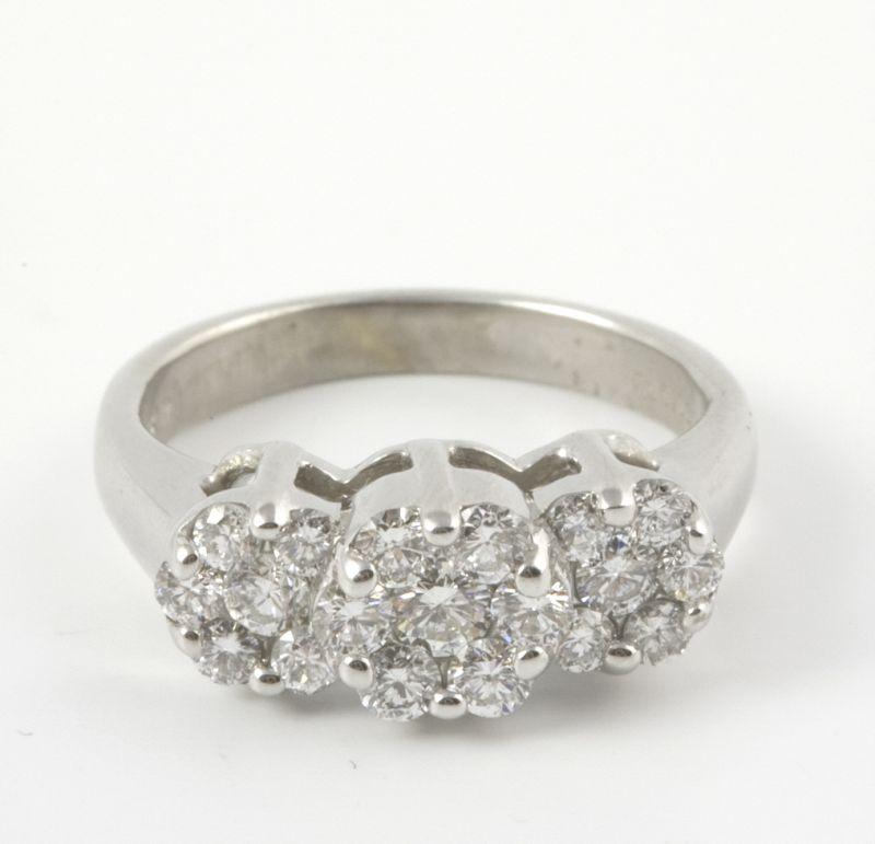 Appraisal: KT White Gold Flower Motif Diamond Ring with three flower