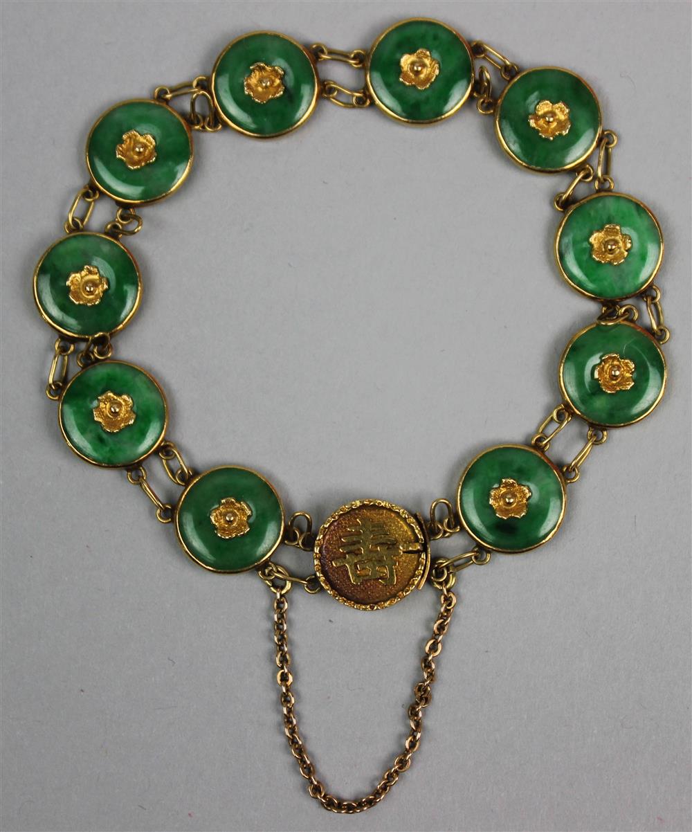 Appraisal: K YELLOW GOLD AND JADEITE LINK BRACELET the bracelet has