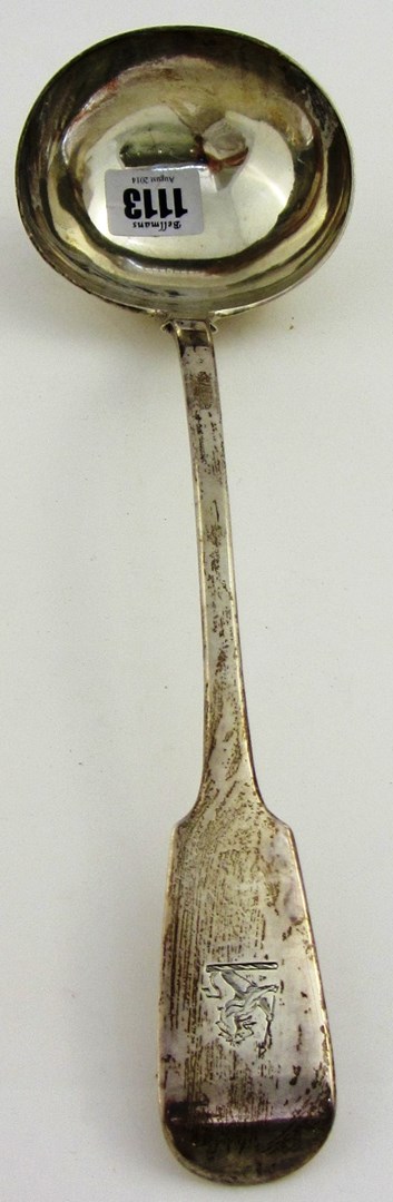 Appraisal: A Victorian silver fiddle pattern soup ladle crest engraved London