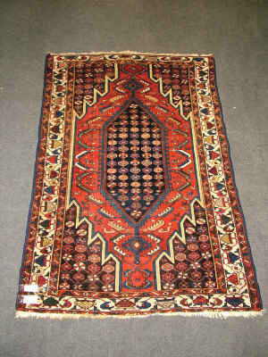 Appraisal: A Mazhagan rug with flower filled deep blue medallion in