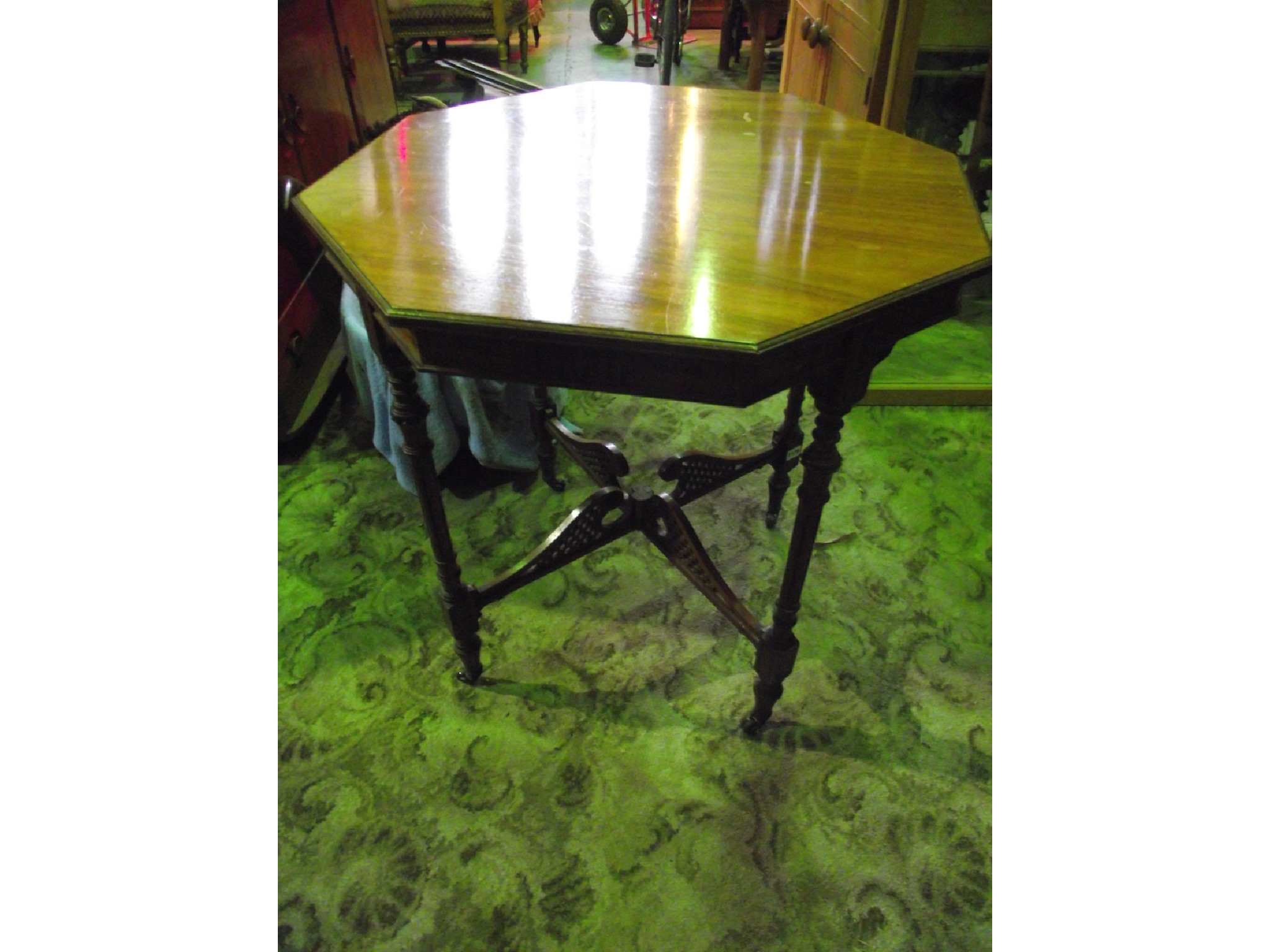 Appraisal: A late Victorian walnut occasional table of octagonal form with