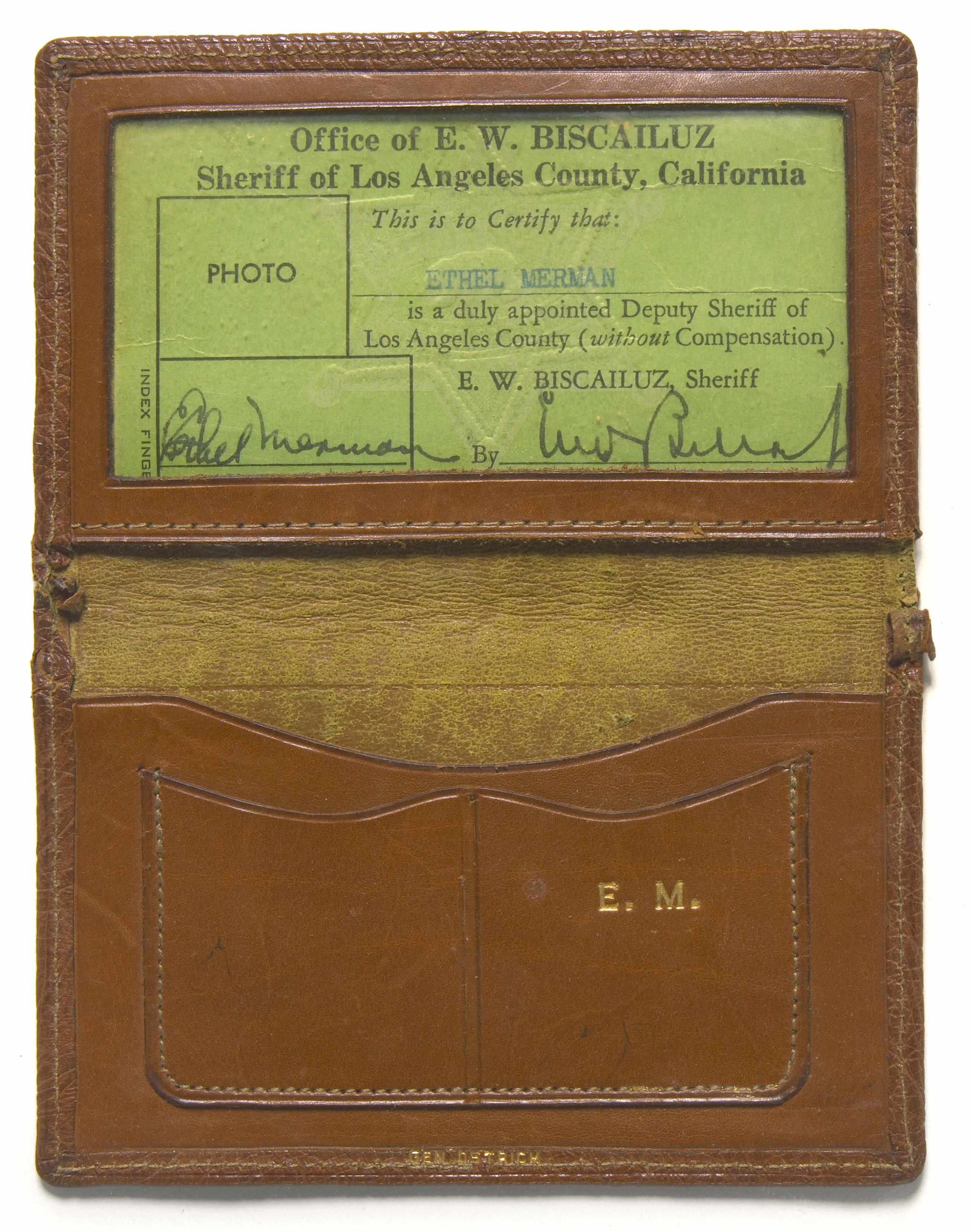 Appraisal: Ethel Merman deputy badge A brown ostrich leather bi-fold wallet