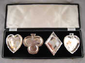 Appraisal: A boxed set of four silver bridge dishes each in