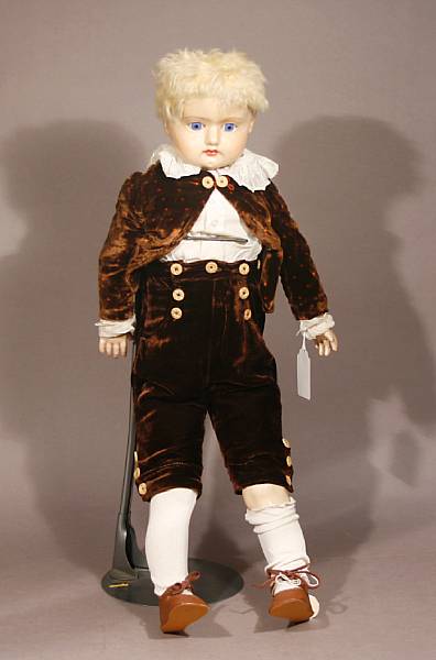 Appraisal: A German wax-over-composition shoulder head doll with blonde hair glass