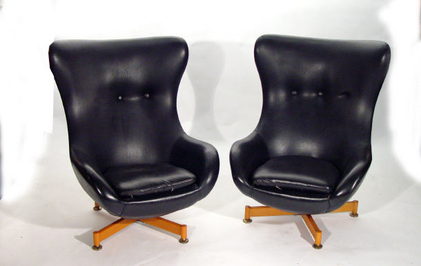 Appraisal: Pair of 's black leather swivel armchairs by Greaves and