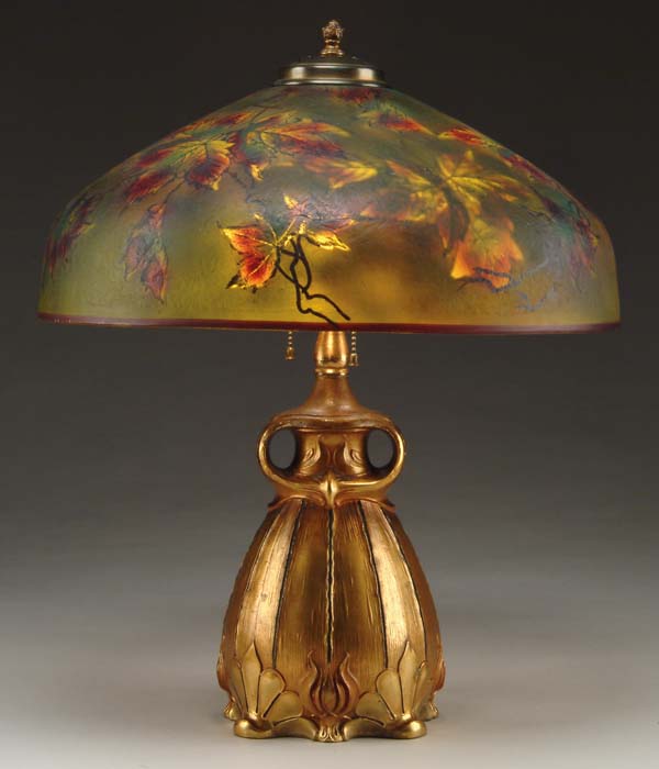 Appraisal: REVERSE OBVERSE PAINTED TABLE LAMP Unique shade has autumn leaves