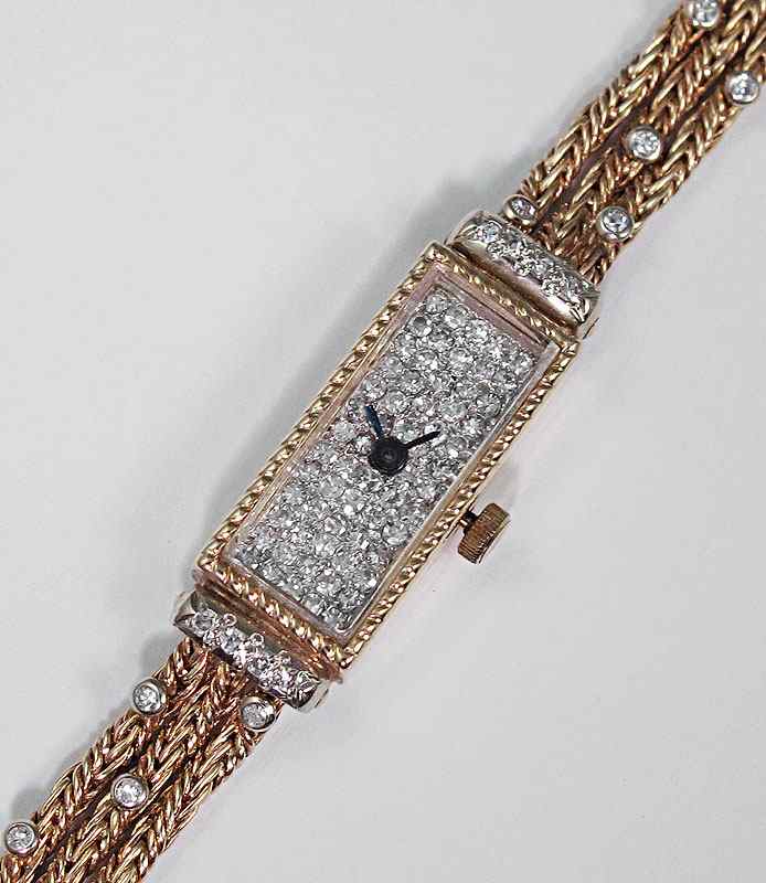 Appraisal: FANCY DIAMOND WRIST WATCH K yellow gold wristwatch contains round