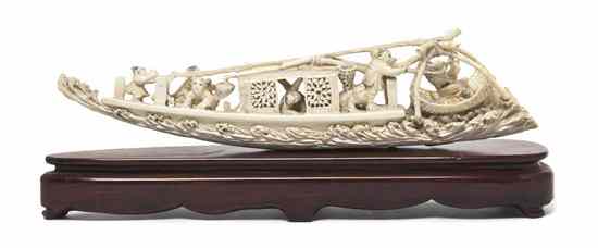 Appraisal: A Chinese Carved Ivory Fishing Boat depicted with figures on