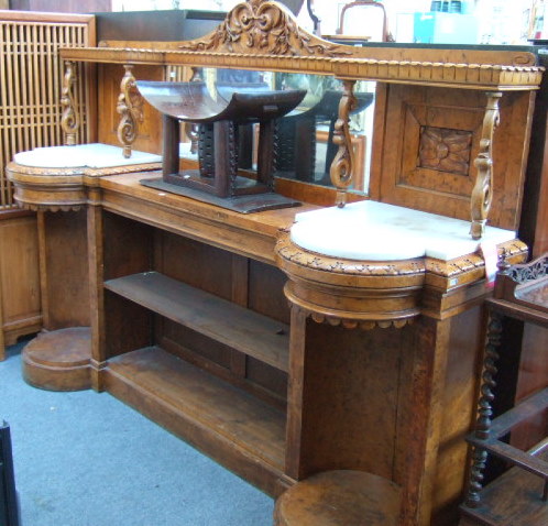 Appraisal: A th century Irish burr elm sideboard the ledge back