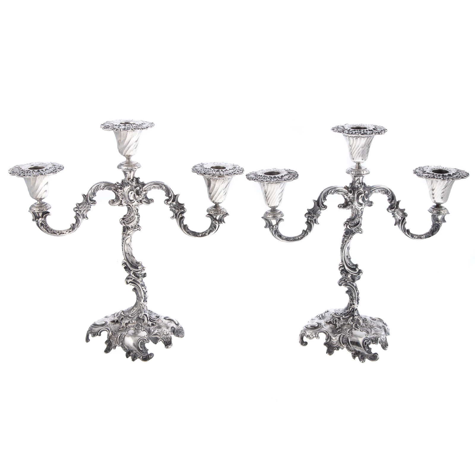 Appraisal: A PAIR OF CONTINENTAL ROCOCO-STYLE SILVER CANDELABRA Marked three-light candelabra