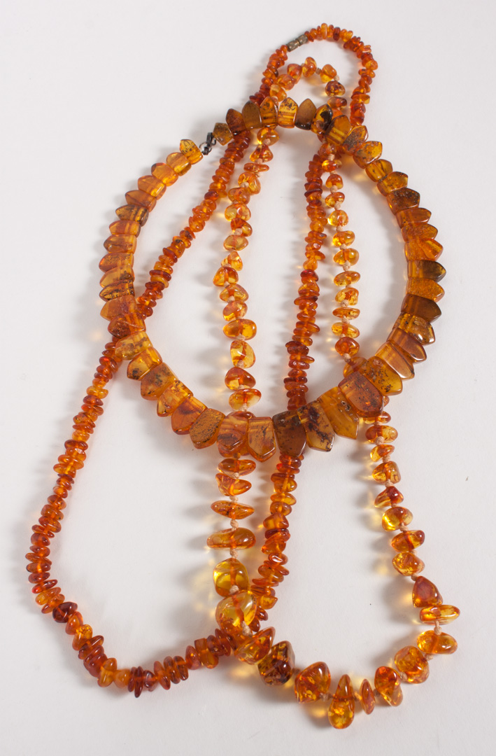 Appraisal: Two amber bead necklaces and a choker longest - in