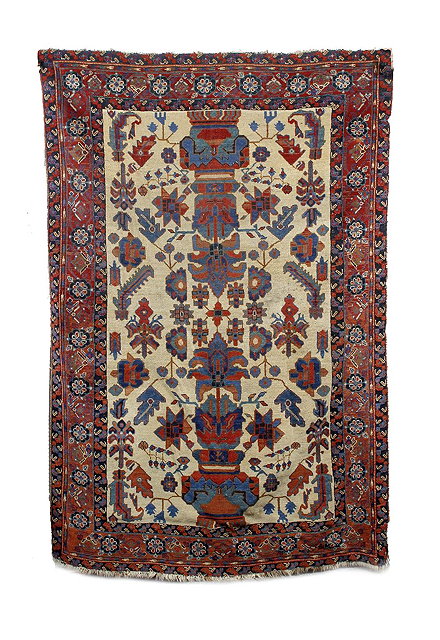 Appraisal: A North West Persian rugwith a central design within a