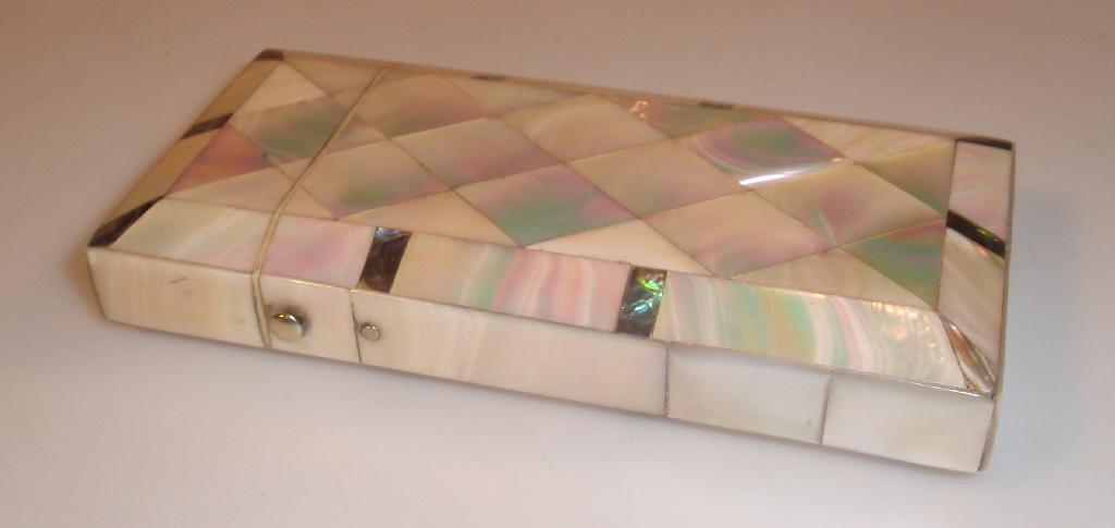 Appraisal: A Victorian mother-of-pearl and abalone shell cigar case with silver