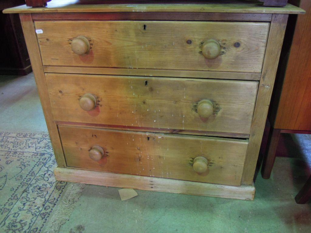 Appraisal: A small stripped pine chest fitted with two long and