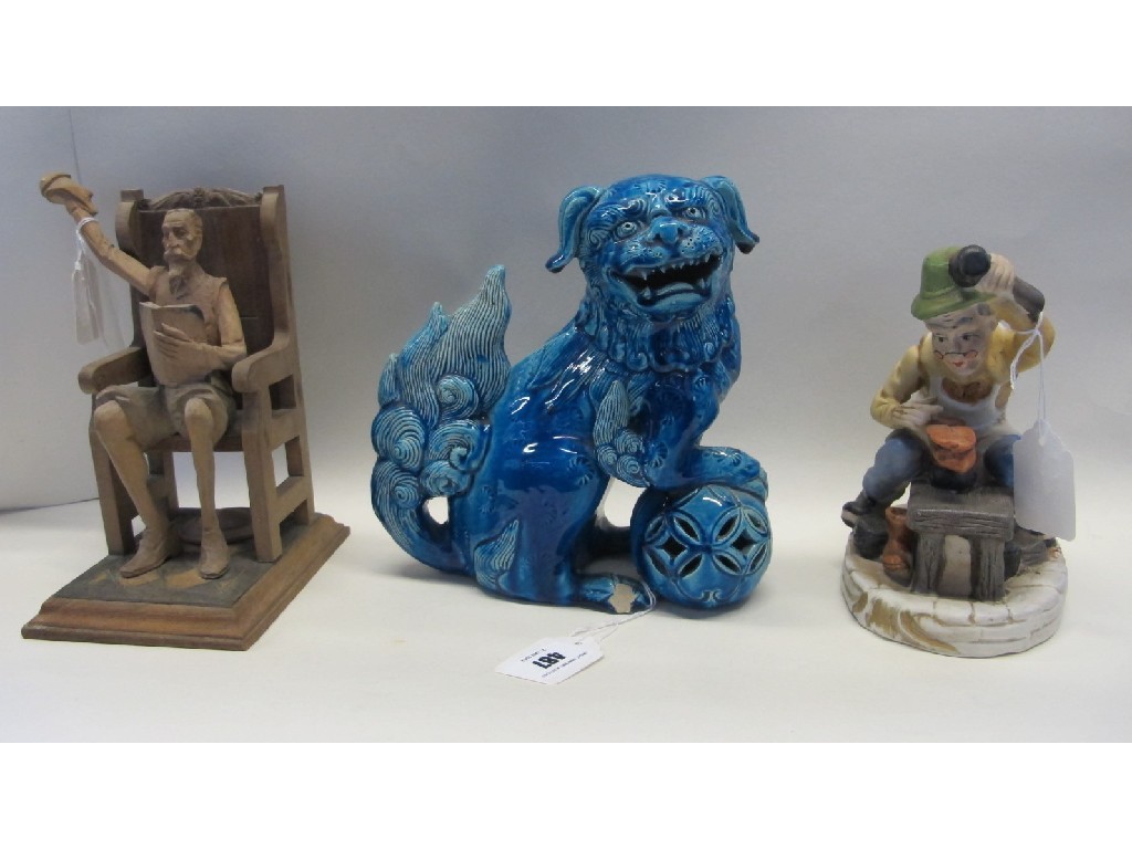 Appraisal: Chinese pottery fo dog carved wooden figure and a ceramic