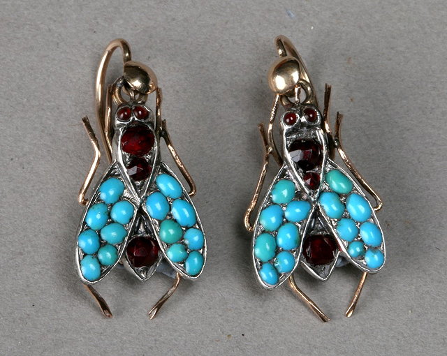 Appraisal: A PAIR OF DROP EARRINGS set with garnets and turquoise