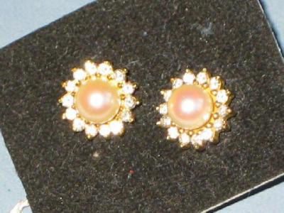 Appraisal: A PAIR OF STUD EARRINGS with single pearl surrounded by