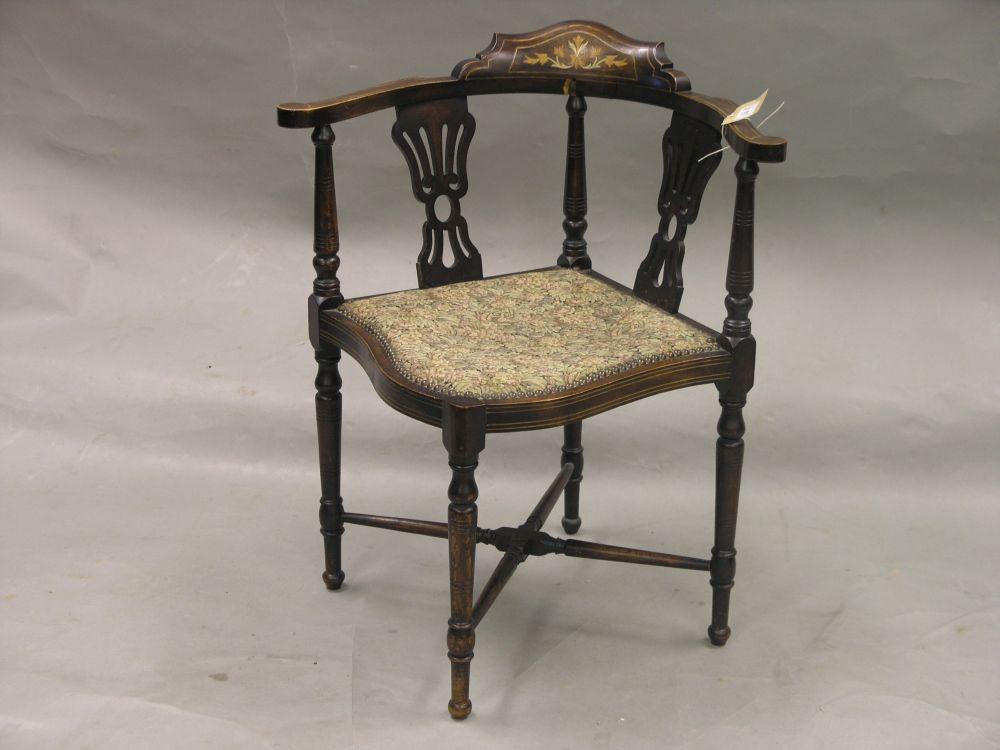 Appraisal: A pair of Edwardian inlaid mahogany corner fitting elbow chairs