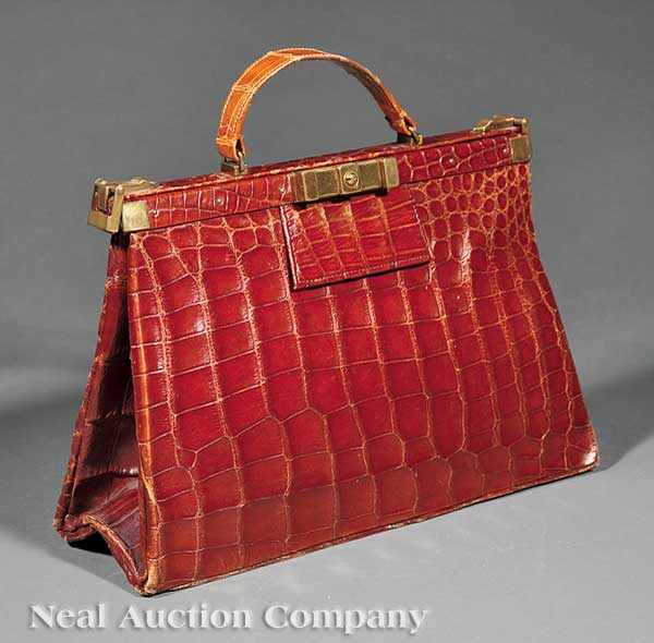 Appraisal: An American Brass-Fitted Brown Alligator Handbag mid- th c trapezoidal