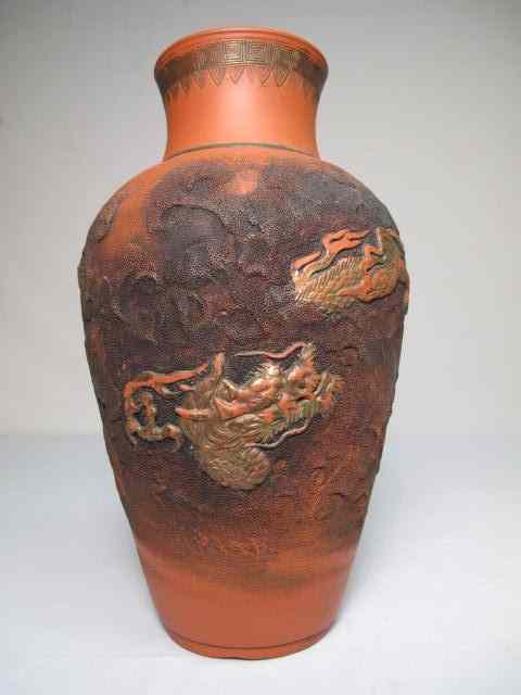 Appraisal: Japanese dragon motif terra cotta clay vase Unique dark cloud