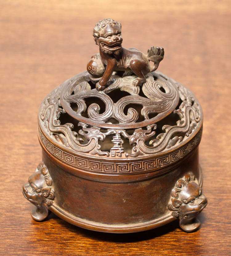 Appraisal: CHINESE QING BRONZE LIDDED CENSOR in round form with domed