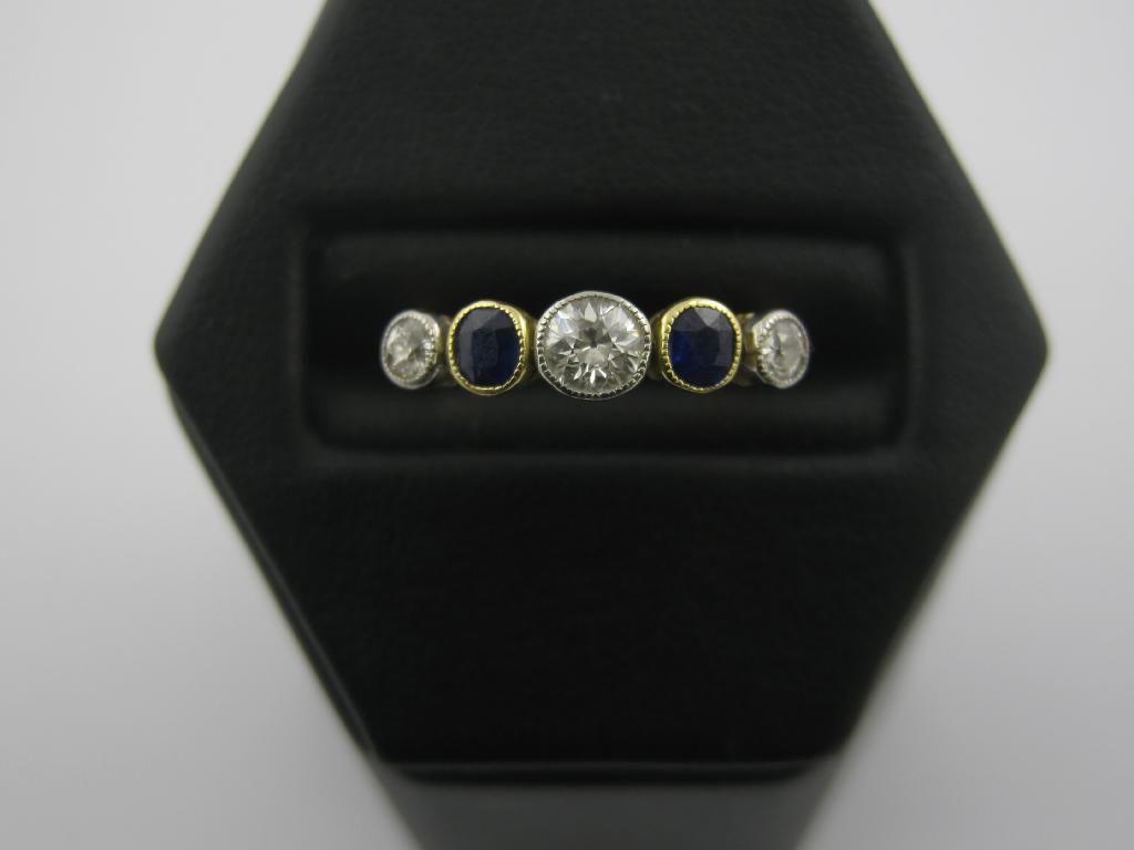 Appraisal: A Sapphire and Diamond five stone Ring collet-set central old-cut