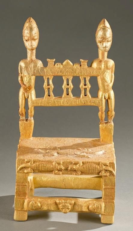 Appraisal: Baule gold leaf chair with male figures A gold leaf