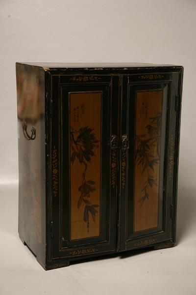 Appraisal: ORIENTAL LACQUERED CABINET Gold and black foliage designs Two doors