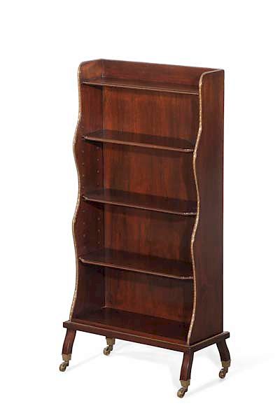 Appraisal: A diminutive English mahogany bookcase A diminutive English gilt bronze