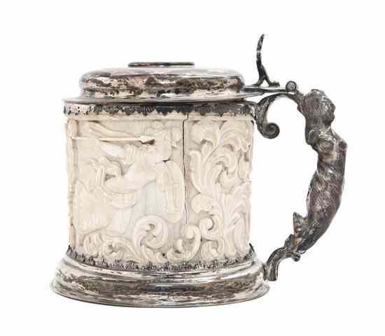 Appraisal: A Continental Ivory and Silver Tankard having an oval lid