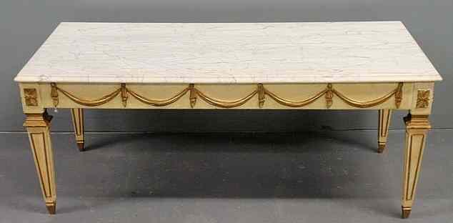 Appraisal: Italian marble top coffee table with a carved base and