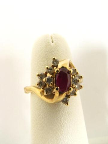 Appraisal: K yellow gold ruby and diamond ring with K sizer