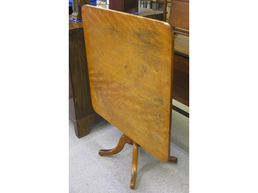 Appraisal: Mahogany rectangular tilt top breakfast table upon quatrefoil base and