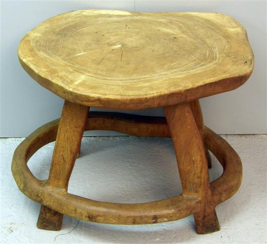 Appraisal: Solid elm occasional table carved out of a single piece