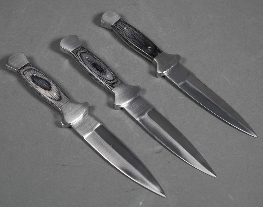 Appraisal: Three handmade custom daggers with leather sheaths from knifemaker in