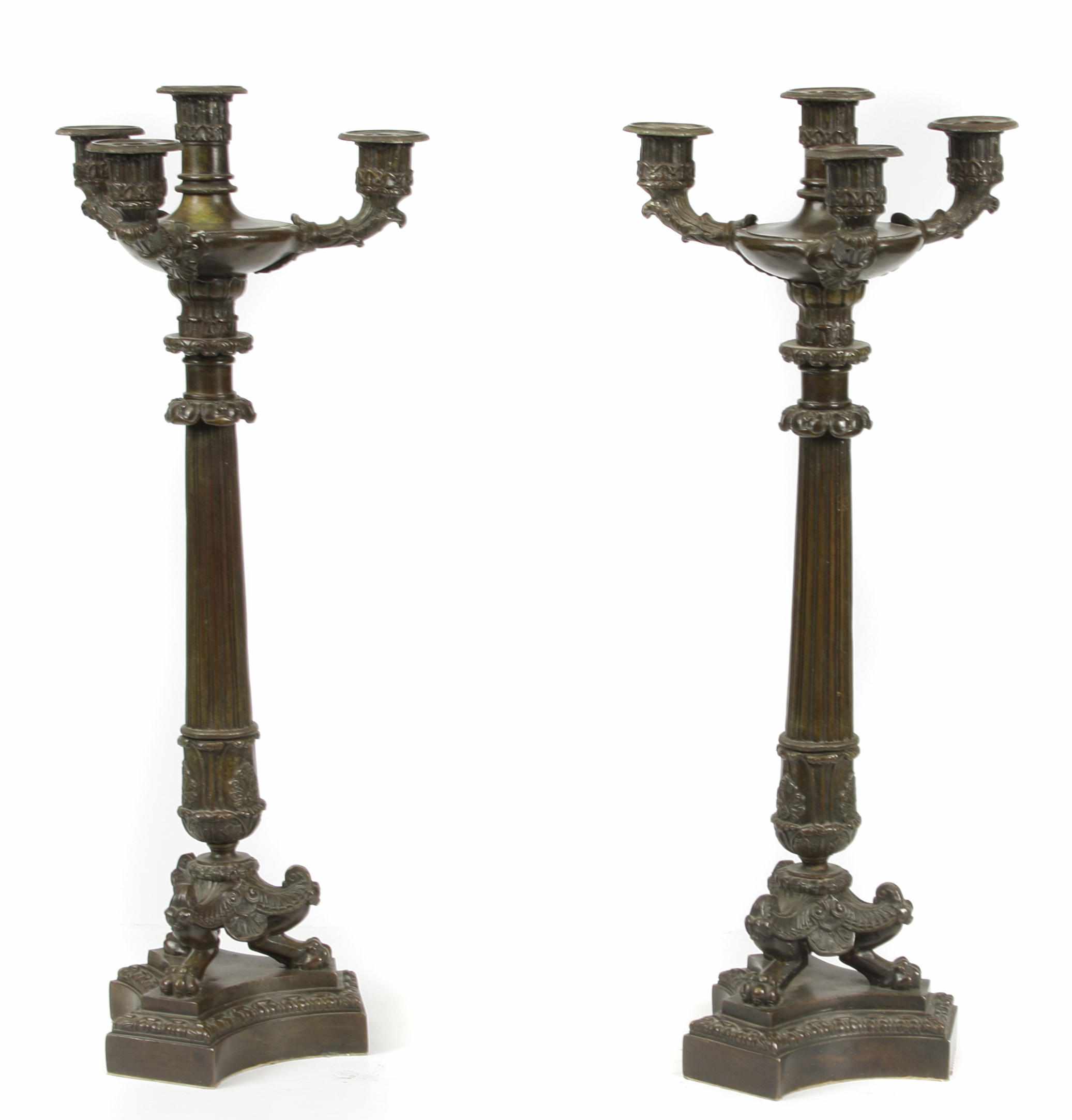 Appraisal: A pair of Charles X style patinated bronze four light