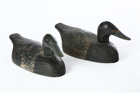 Appraisal: PAIR OF DECOYS American th century softwood Primitively carved ducks