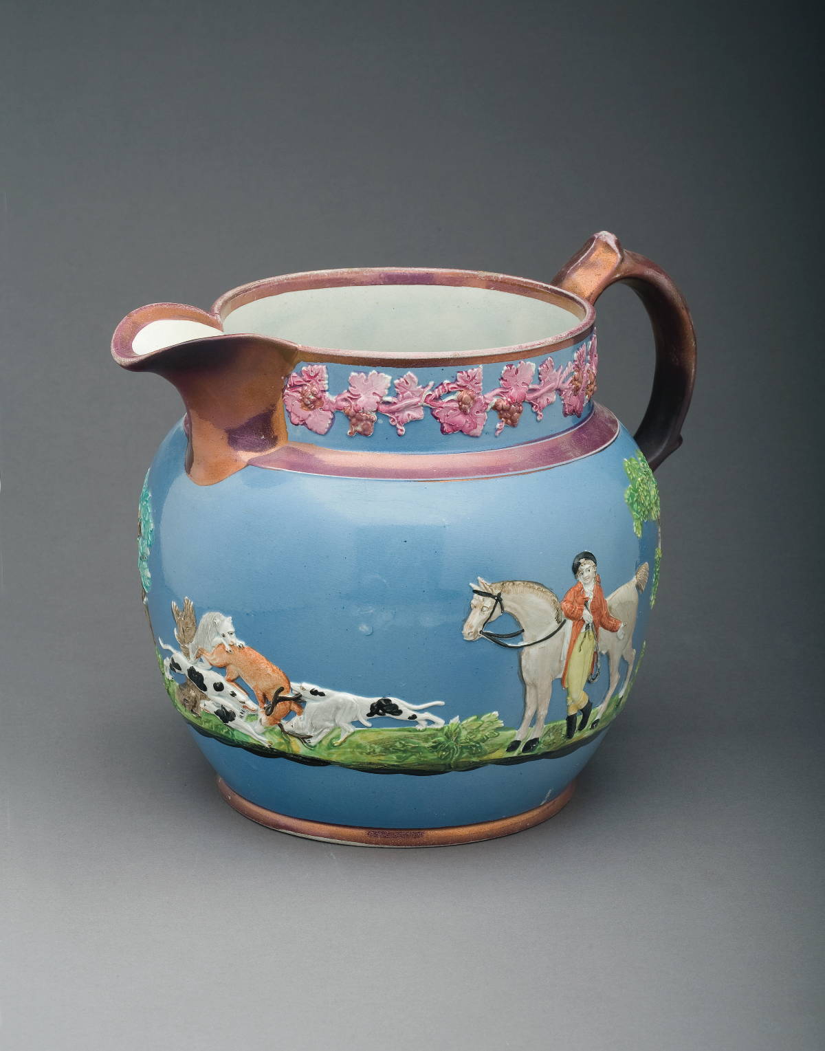 Appraisal: WOOD CALDWELL PEARLWARE PINK LUSTRE AND ENAMEL-DECORATED BLUE-GROUND HUNT JUG