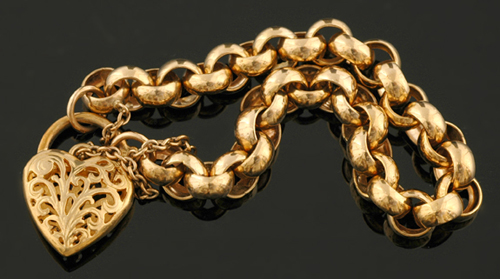 Appraisal: A gold heart padlock bracelet The ct gold belcher link