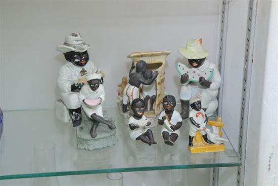 Appraisal: GROUP OF SEVEN BLACK BISQUE FIGURINES Including two black figures