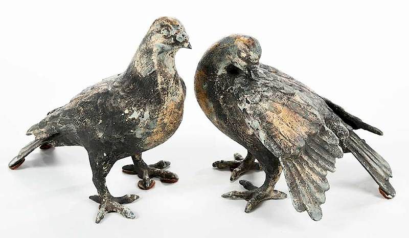 Appraisal: Pair Metal Pigeons th century stylistic black green and gilt